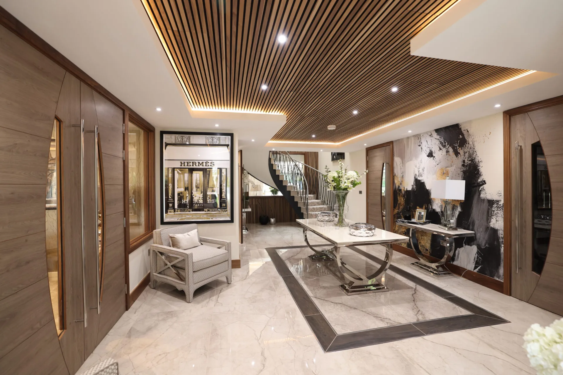 Entrance hall with walnut joinery and a slatted timber ceiling